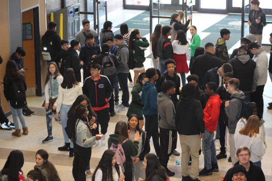 After eating lunch, students gather in the commons and talk with friends while they wait for the bell to go back to their third block class on Feb. 12. At any given time during lunch up to 450 students are in the cafeteria or in the commons. 