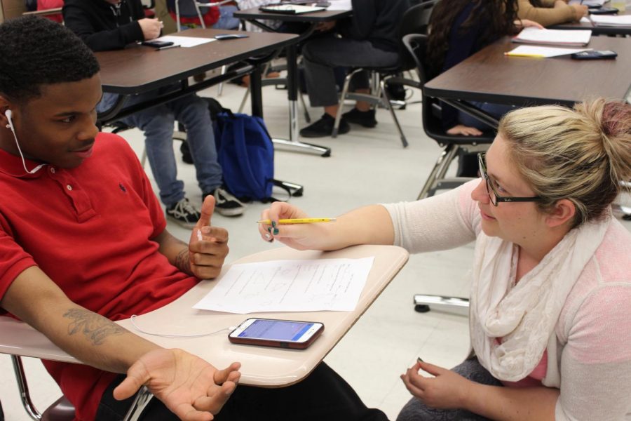 As a co-teacher for math teacher Allen Nesbitt’s Geometry 2 class, special education teacher Rachel Allen helps junior Perry Jackson with his test.