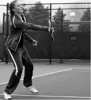 In her singles match against Grand Island, number one singles player junior Olivia Rickley returns the ball with a forehand swing on April 5, at the Westside tournament. Rickley went on to win the match 9-7.