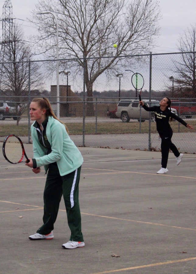 Serving+the+ball+to+her+opponent%2C+sophomore+Sophia+Rubenstein+starts+the+new+point+while+junior+Olivia+Rickley+waits+for+the+return.+Being+the+last+team+to+play+a+doubles+match+against+Omaha+South+High%2C+Rubenstein+and+Rickley+were+the+only+thing+standing+between+a+loss+or+win.+After+a+rough+start%2C+the+girls+pulled+through+and+won+8-2%2C+making+the+teams+overall+score+5-4.+