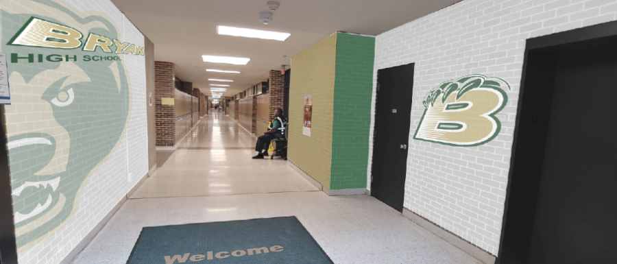 After taking a photo of the hallway all students pass through as they enter the building each day, social studies teacher and Branding Committee member Nicholas Wennstedt makes a mock up of an idea of what the entrance could possibly look like in the near future utilizing the school’s new logos and official colors. Principal Dr. Rony Ortega plans to meet with two companies before winter break to get estimates of this potential project and others throughout the school.