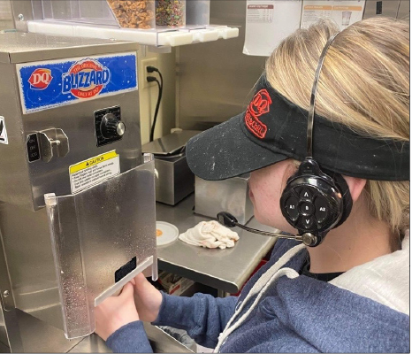 Making a blizzard at her work on Oct. 25, sophomore Natalie Besta starts her shift at the Dairy Queen on 72nd and Q. 