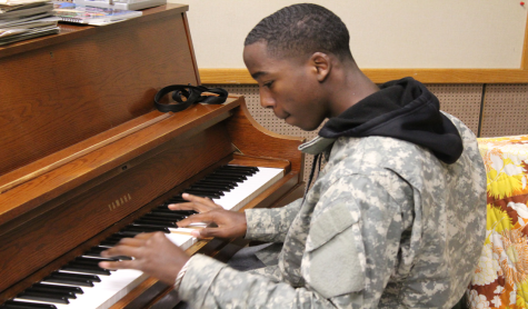 Playing the piano, senior Don Hannon practices for the Martin Luther King Jr. contest in January. Hannon will be playing the piano while performing a song he wrote.