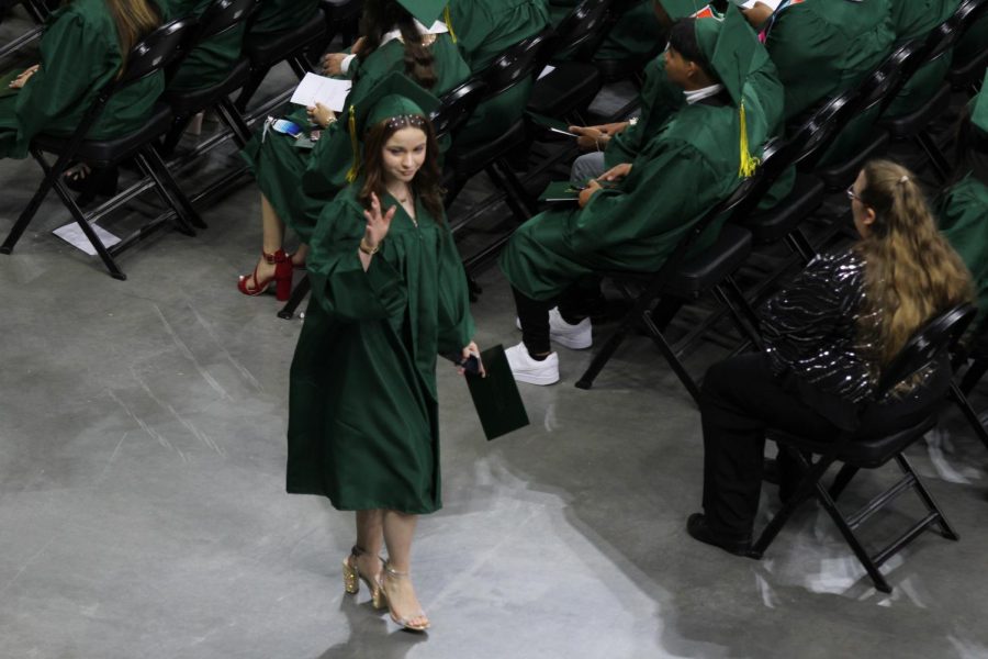 Senior Hailey Vizcaya walks back to her seat after recievering her diploma.
