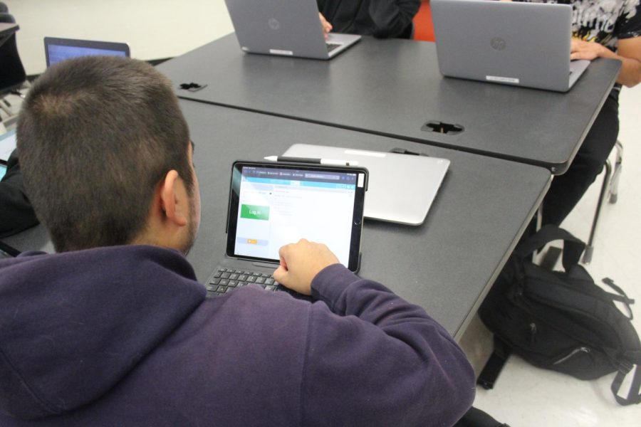 Senior Erick Barrera Bustamante uses a login screen activity to learn about app design. 