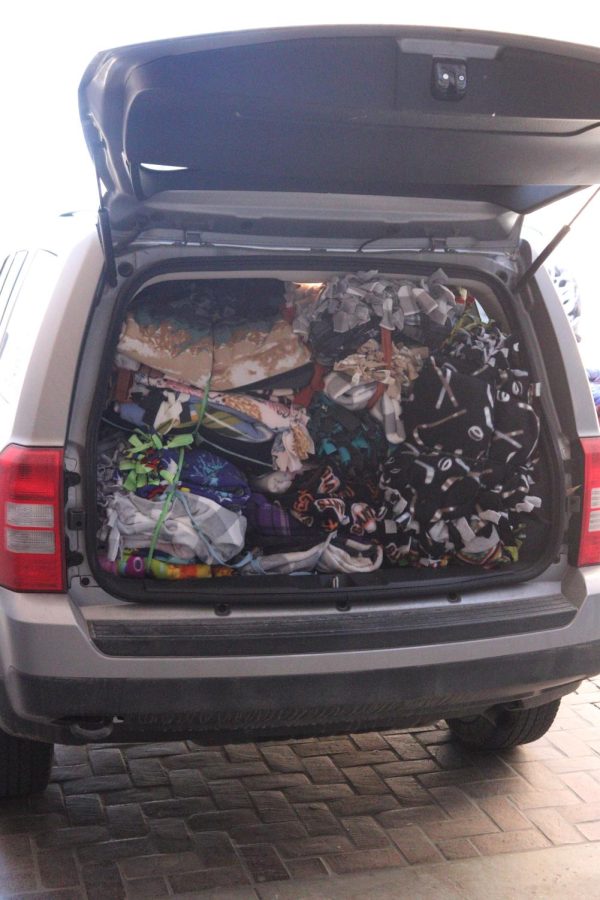 an SUV filled with blankets created during the Project Linus event hosted by the National Honor Society on March 5. The blankets went to Offutt Air Force Base. 