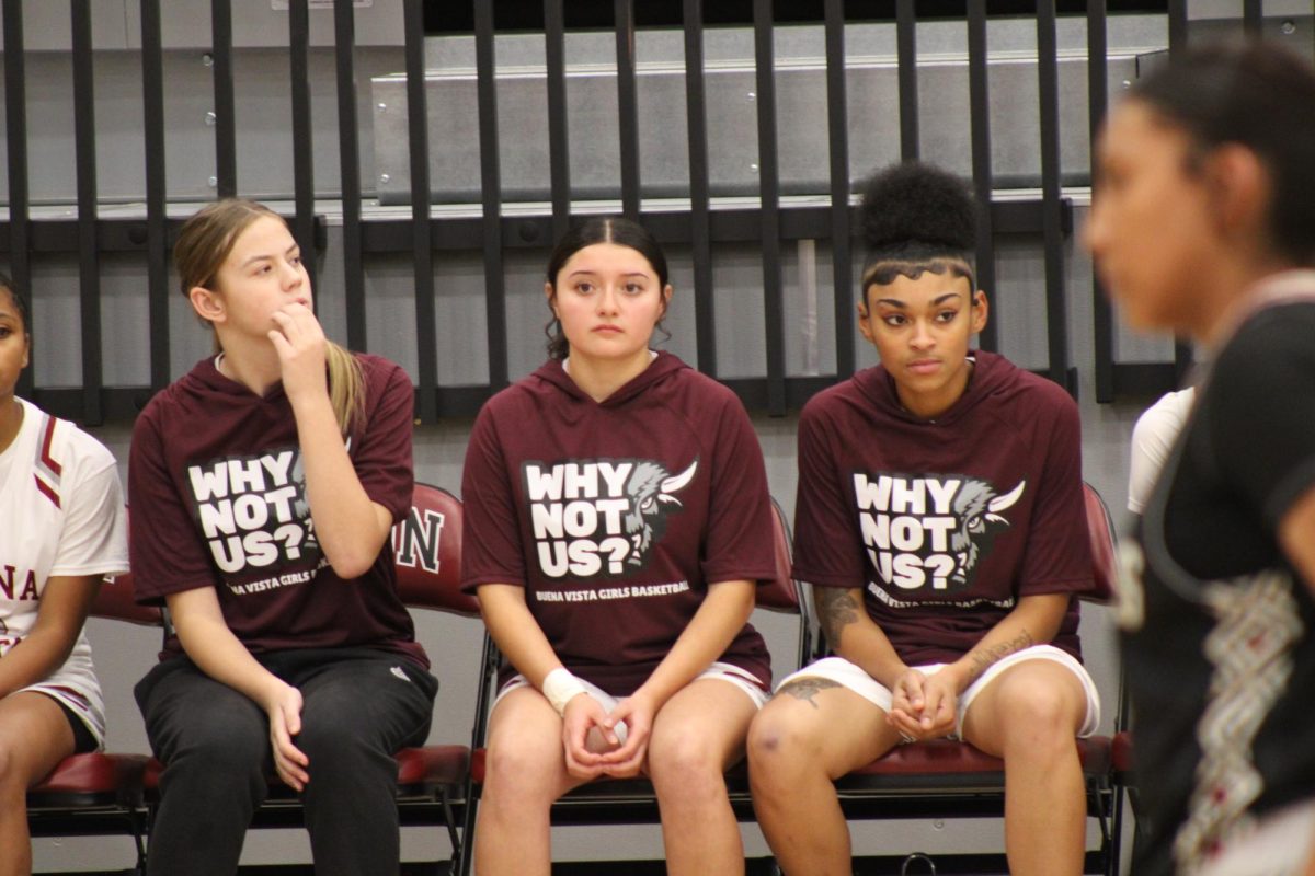 Juniors Brookelynn Allen, Genesis Castillo and Gyana Ellis watch the game versus South at Buena Vista Dec. 13. Bison beat the Packers 49-39. Photo by Lizbeth Lagunas Nava