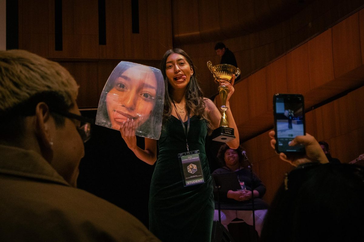 THE WINNER IS... Sophomore Gabriela Moran-Zinzun poses with a cut-out of herself and trophy after winning first place for the Spoken Word: Anti-Racism category at the seventh annual Martin Luther King, Jr. “Living the Dream” competition Jan. 20. Moran-Zinzun
performed a speech against the prejudice of immigrants, highlighting her own family’s story. Photo by Maryann Bautista