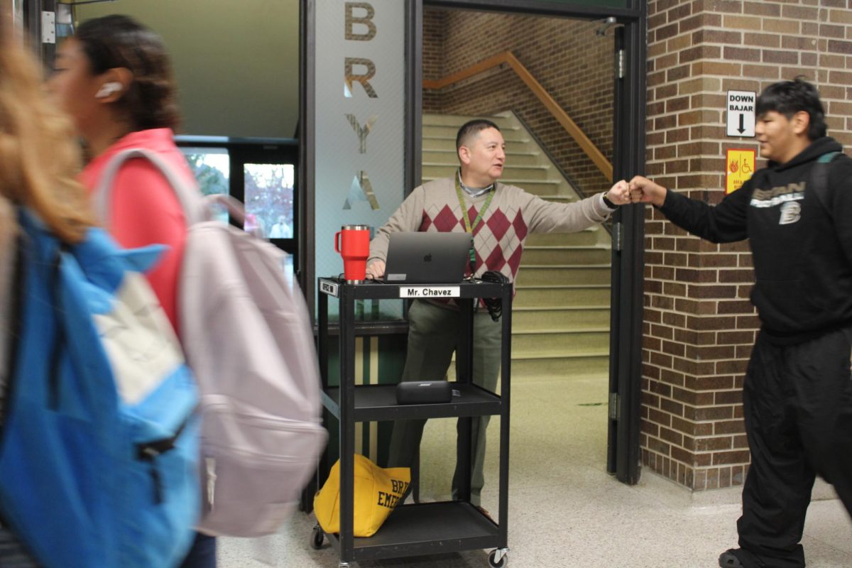 On Nov. 13 , industrial technology teacher Jorge Chavez greets senior Brandon Diego-Padilla in the morning.