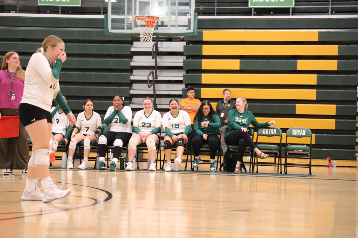 On Sept. 4 during a match against Buena Vista, junior Genesis Rodriguez, junior Emiah Morris-Blackson, senior Kendall Holtmeyer, junior Jaslene Craine, freshman coach Alieris Cruz Nieto and varsity coach Keiley Hein laugh at their team's fault at an attempt to get the ball over.