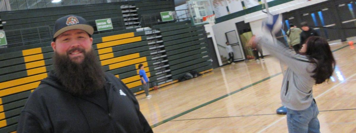 On Feb. 18 during B3, new PE teacher Matthew Storm takes a break from playing volleyball. Storm joined the losing team, making sure both had a chance against each other.